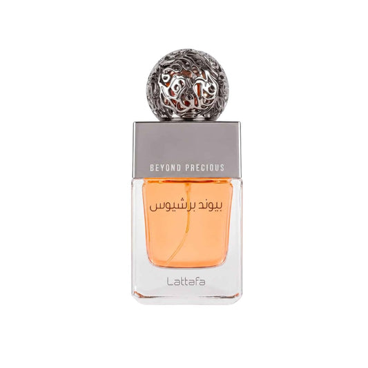 Lattafa Beyond Precious perfume bottle with a silver cap and orange liquid, shown on a white background.