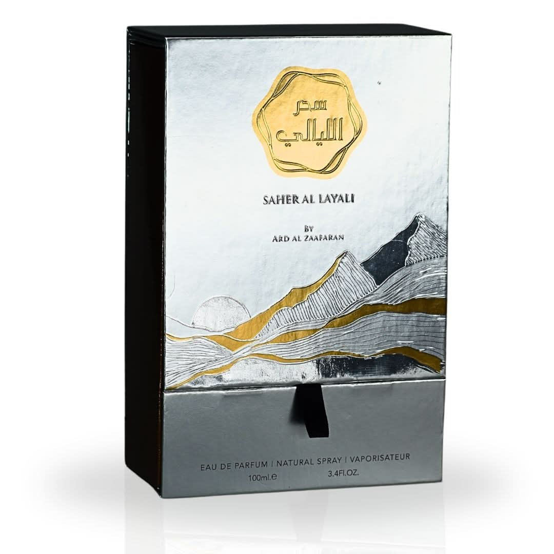 Saher Al Layali perfume packaging with mountain design and gold accents on a white background