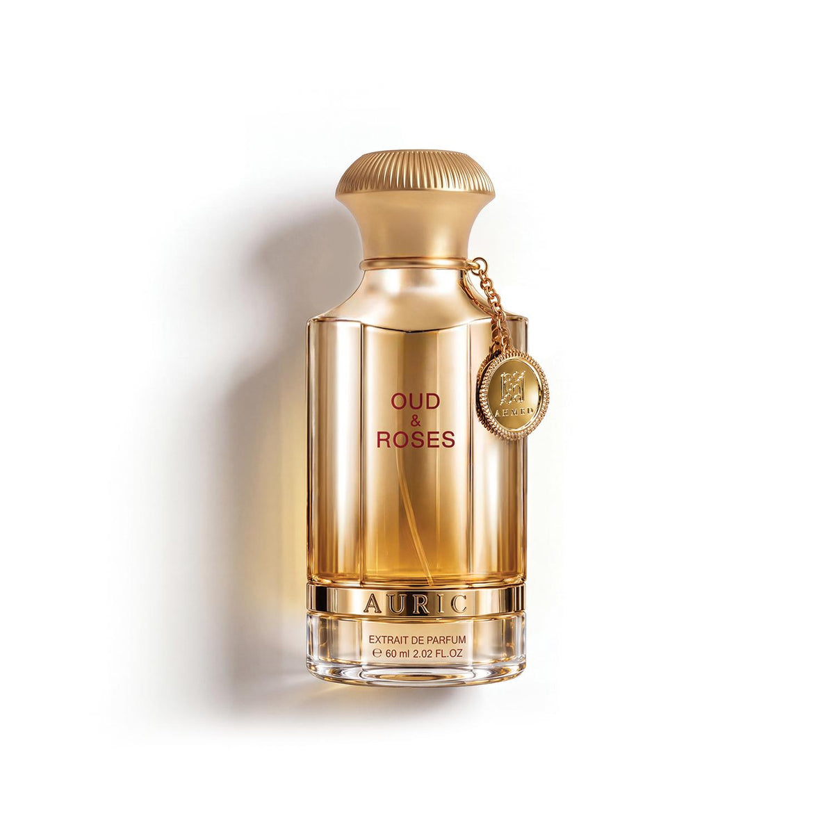 Auric Oud des Roses Extrait de Parfum in a faceted gold glass bottle with a ribbed gold cap and a hanging gold coin charm, set against a clean white background.
