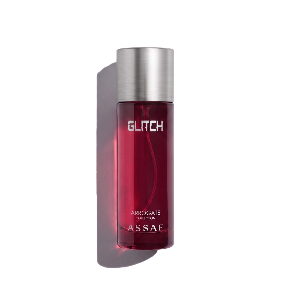 Assaf Glitch Arrogate Collection bottle, featuring a deep translucent red glass body and a brushed silver metallic cap, set against a plain white background.