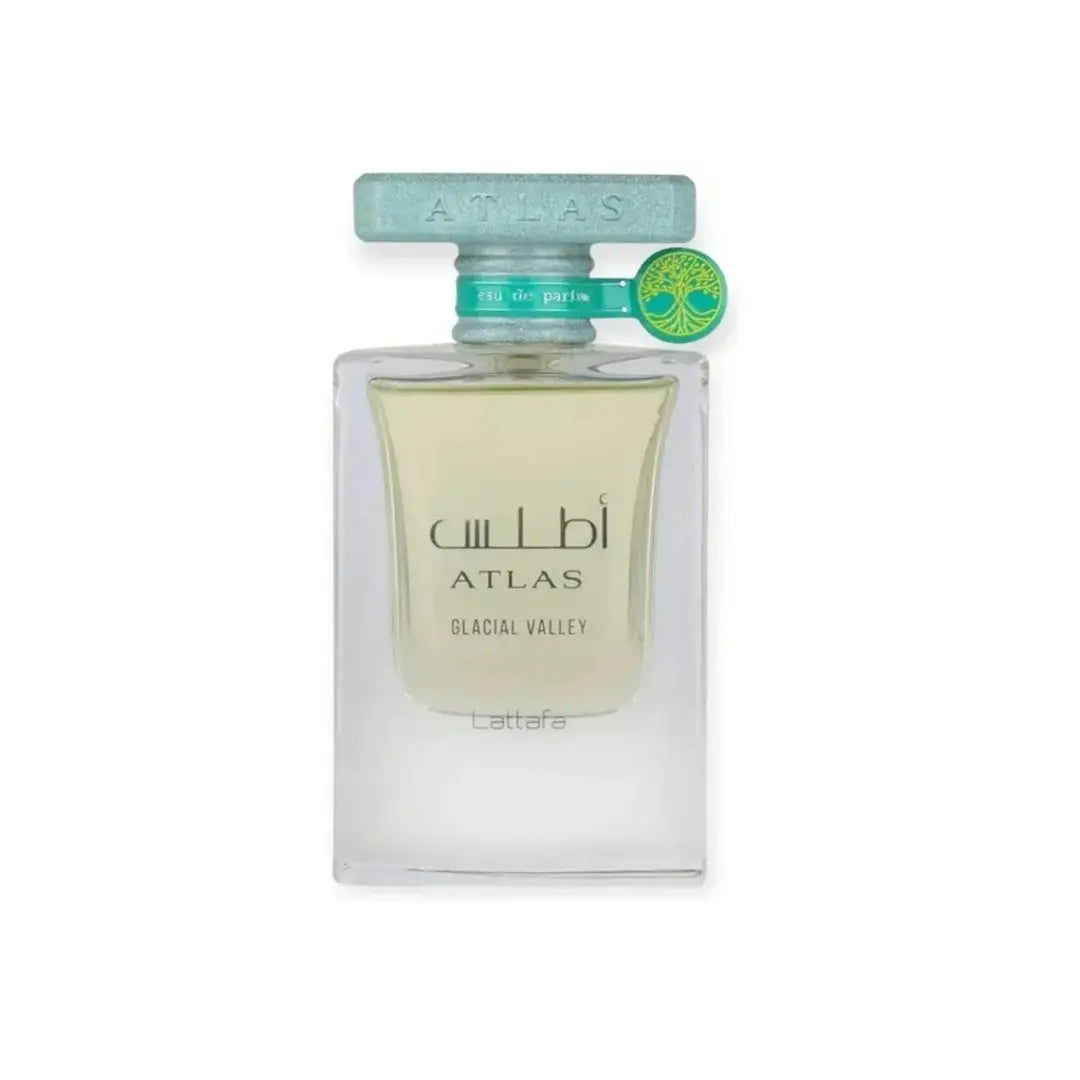 A bottle of Atlas Atlas Glacial Valley Eau de Parfum with a clear glass body, pale yellow liquid, and a light blue cap, shown on a white background.