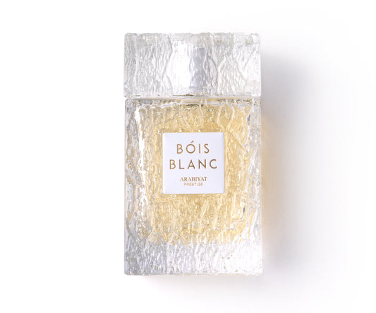 Bois Blanc perfume bottle with textured glass and white label on a white background